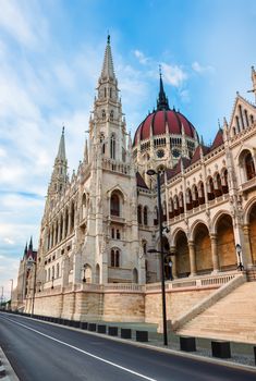 Hungarian Parliament and road in Budapest at sunset