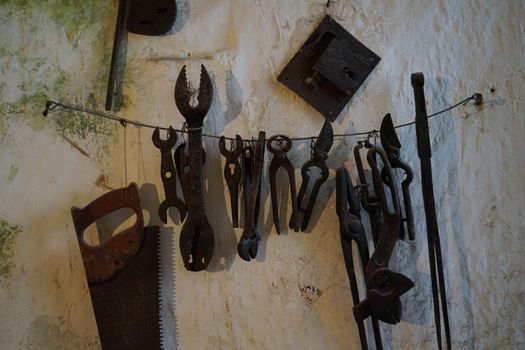 Old tools working in a cave house in Matera