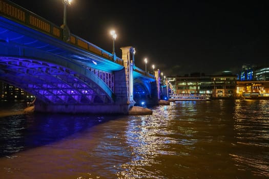 Thames with London Bridge and night lights