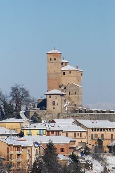 View of Langhe hills with Castle and snow, Piedmont - Italy