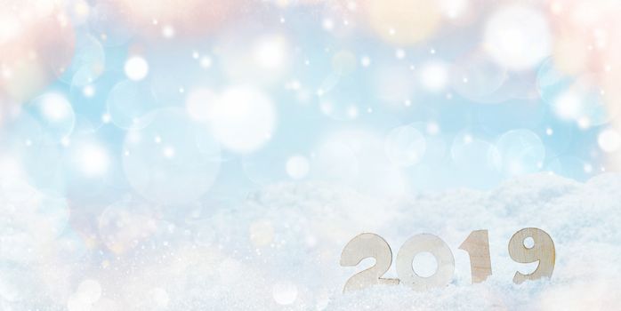 Sigh symbol of Happy new year 2019 holiday or Christmas , snow and bokeh lights background with copy space for text
