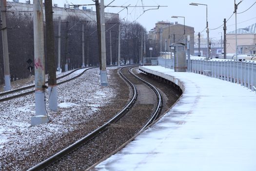 railway forward, railway station platform empty in winter