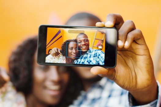 These young people take pictures trough mobile phone