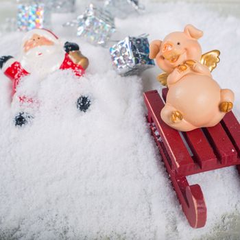 Funny naughty pig laughing at santa claus accident who fall from sleigh and lost gifts