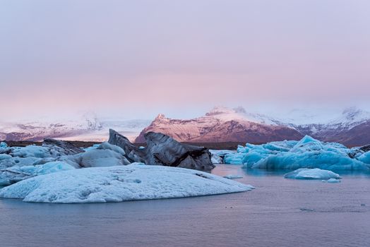 Icebergs in the Jokulsarlon's lake near Vatnajokull glacier at sunrise, Iceland