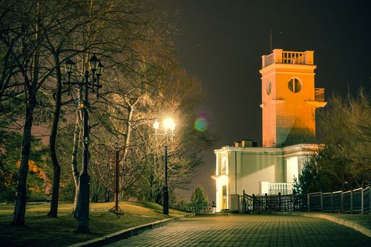 Amur Cliff at night. Lit by lanterns.