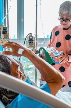 Elderly patients relax in hospital bed