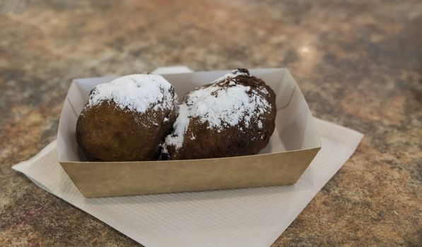 A treat called oliebollen in dutch, which is traditional sweet food for New Year's eve in the Netherlands