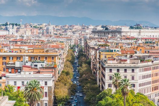View of a tree-lined avenue on the city of Rome in Italy