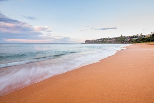 Waves wash up onshore at Bungan Beach, northern suburbs Sydney Australia