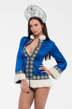 Sexy woman dressed in traditional russian christmas costume of Snegurochka Snow Maiden , isolated on white background.