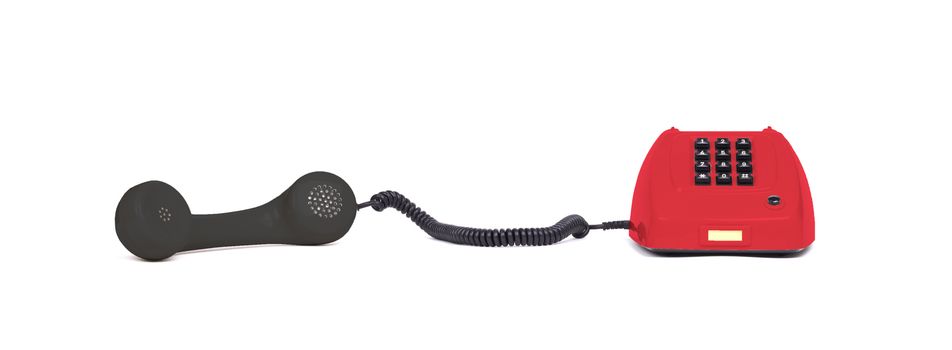 Vintage multi colored telephone with a white background