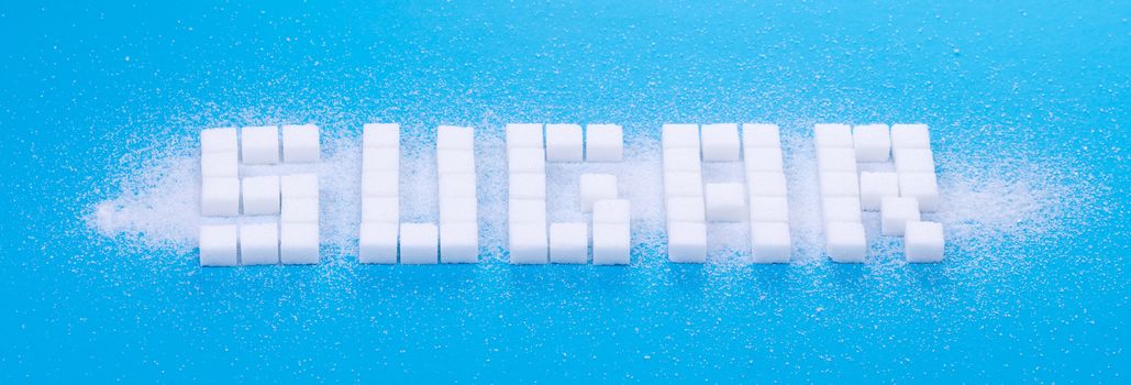 White sugar cubes background - Concept of unhealthy eating