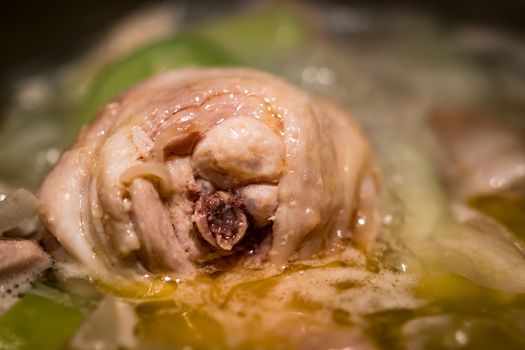 closeup of a cooking homemade chicken bouillon in a pot