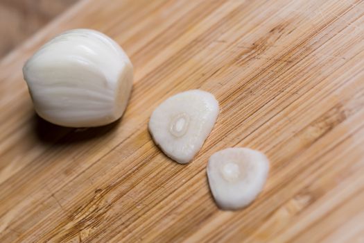 Closeup of a sliced garlic glove on a table