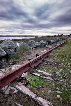 An Abandoned Railroad Track Rusts Under Stormy Skies, Arcata, California