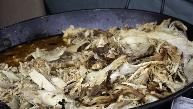 Meat stewed in a restaurant casserole, homemade food