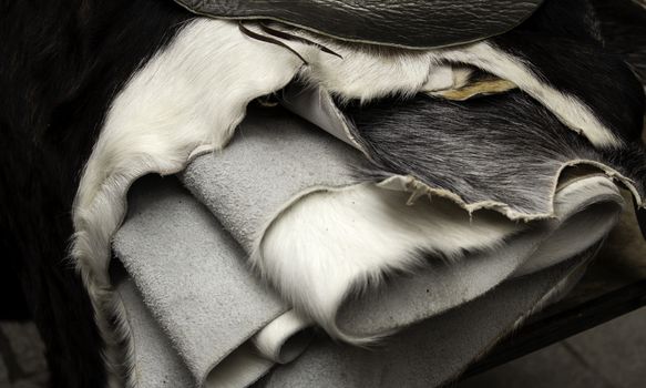 Natural animal skins in fur, fashion accessories, blankets