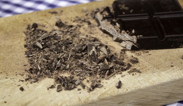 Grated black chocolate tablet, sweets and desserts