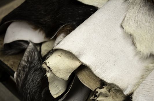 Natural animal skins in fur, fashion accessories, blankets