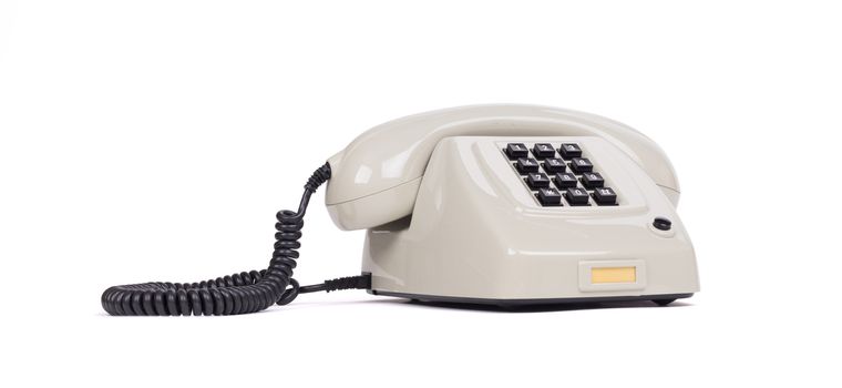 Vintage grey telephone with a white background