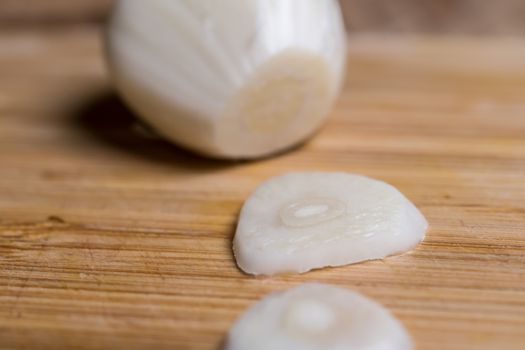 Closeup of a sliced garlic glove on a table