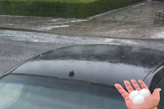 Big hail ice balls on car hood after a heavy hail storm