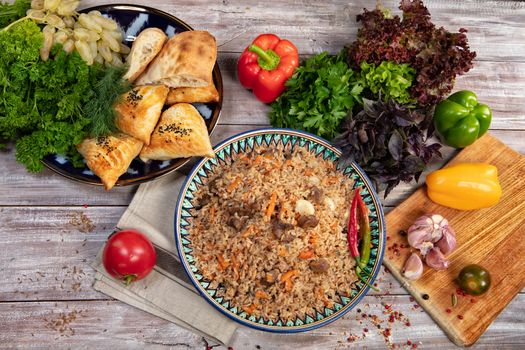Asian traditional food and vegetables on an old wooden table