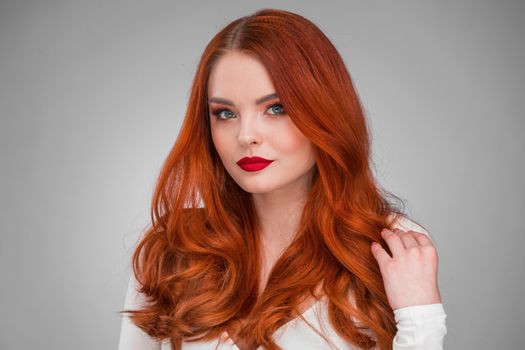 Beauty portrait of woman. Gorgeous sensual attractive pretty redhead sexy model girl, shiny wavy hair