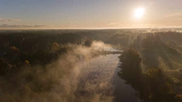 Morning smoke on the water Ulbroka lake Aerial drone top view Latvia