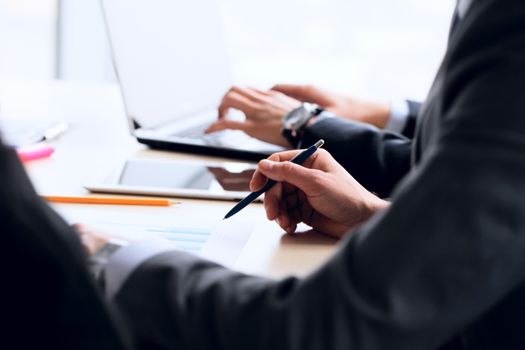 Business people working together with financial reports