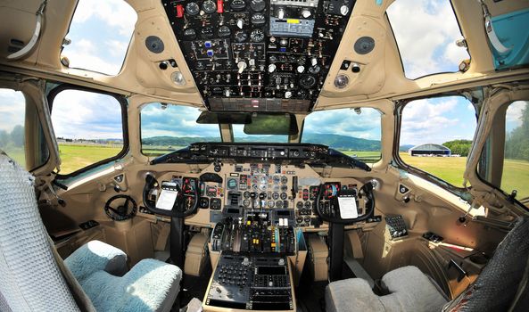 Vintage passenger jet aircraft cockpit interior, pilot's instrument panel