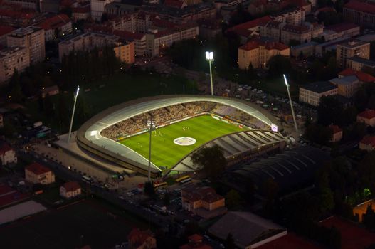 Maribor, Slovenia - 18 August 2011: Ljudski vrt arena is home stadium to NK Maribor football club. Aerial view of illuminated footbal stadium at dusk.