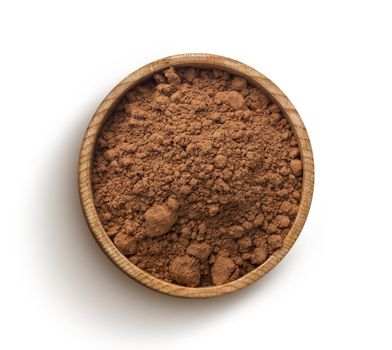 Cacao. Pile of cocoa powder in wooden bowl isolated on white background, top view