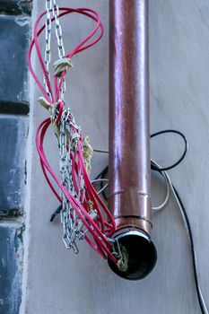 Closeup of water downspout on the house roof. Rain drainpipe at the house wall in Riga, Latvia. 