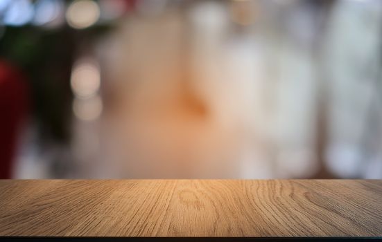 Empty dark wooden table in front of abstract blurred bokeh background of restaurant . can be used for display or montage your products.Mock up for space