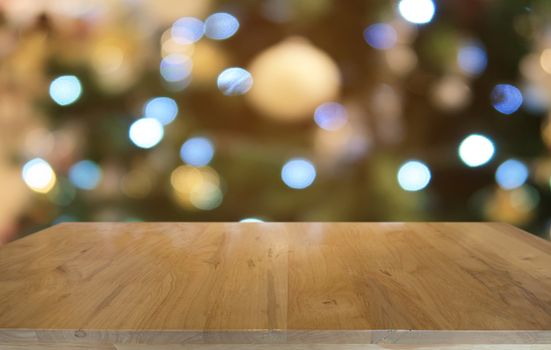 Empty dark wooden table in front of abstract blurred bokeh background of restaurant . can be used for display or montage your products.Mock up for space