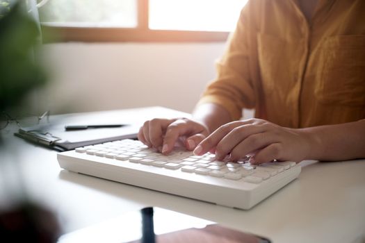 Business accounting women work with calculator and Laptop. Financial technology concept.