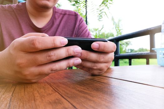 Man playing game on mobile phone