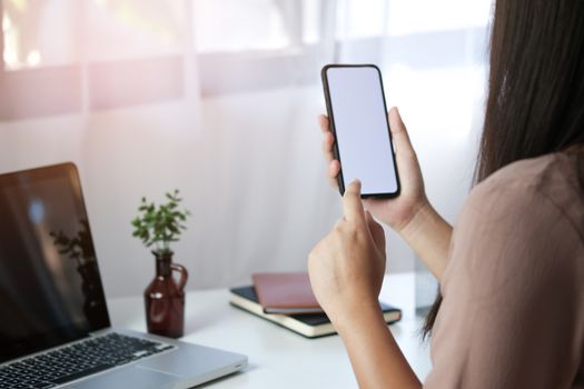 Close up of women's hands holding cell telephone blank copy space screen. smart phone with technology concept