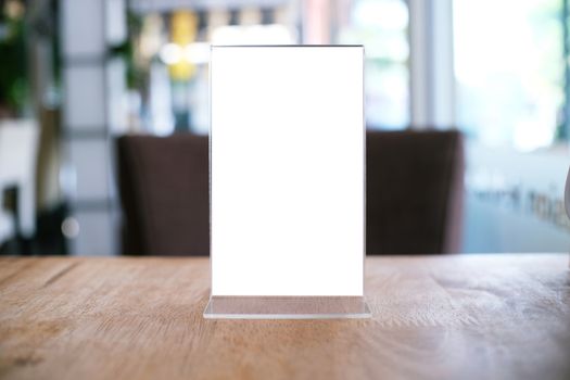 Menu frame standing on wood table in Bar restaurant cafe. space for text marketing promotion