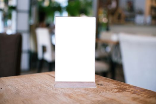 Menu frame standing on wood table in Bar restaurant cafe. space for text marketing promotion