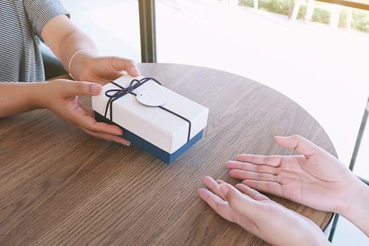 Valentine present. Gift box and red ribbon for romantic couple