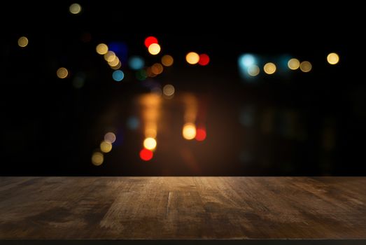 Empty wooden table in front of abstract blurred background of bokeh light . can be used for display or montage your products.Mock up for display of product