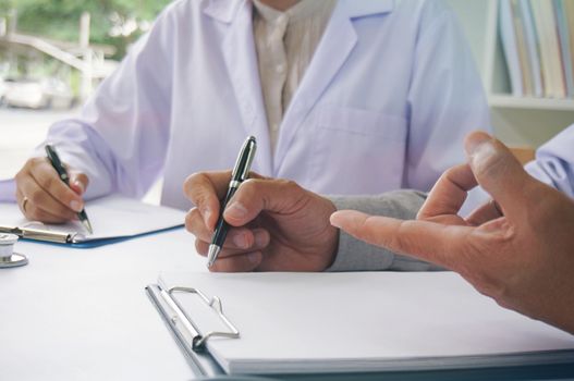 Professional medical doctor in white uniform gown coat interview patient are discussing in hospital