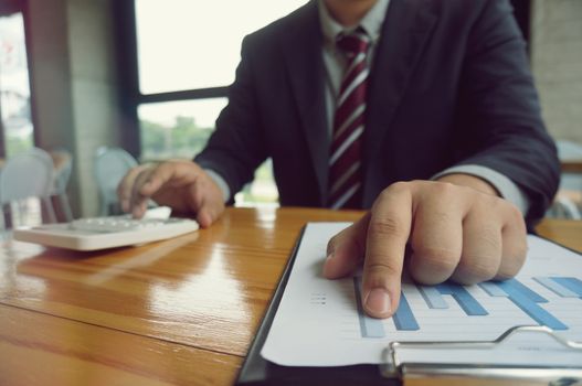 Hands of business people analyzing chart Finance managers task