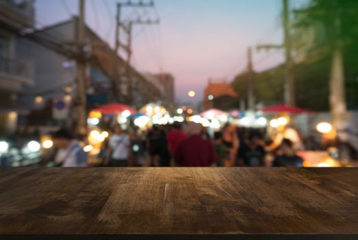 Empty wooden table in front of abstract blurred background of coffee shop . can be used for display Mock up  of product.