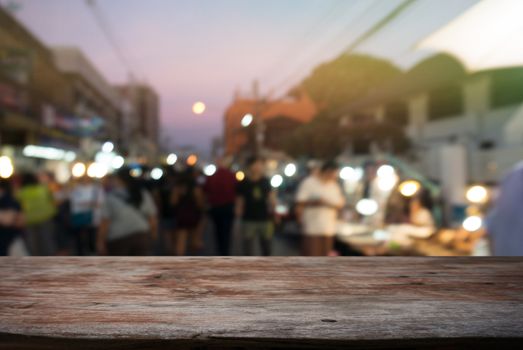 Empty wooden table in front of abstract blurred background of coffee shop . can be used for display Mock up  of product.