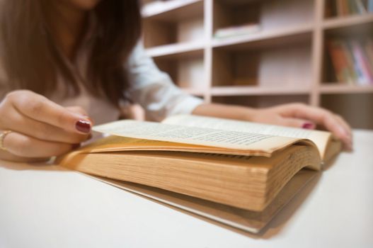 women reading book and relaxing in her living room.selective focus.