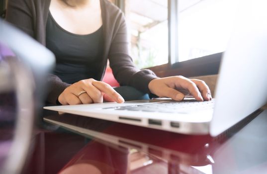 Accountant Working women use calculator with Spreadsheet document information financial concept.